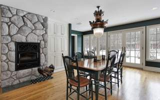 Breakfast room with stone fireplace